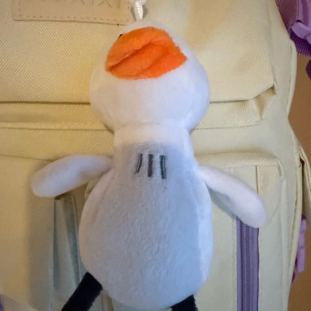 Cream Backpack with Purple Accents and Plush Keychain